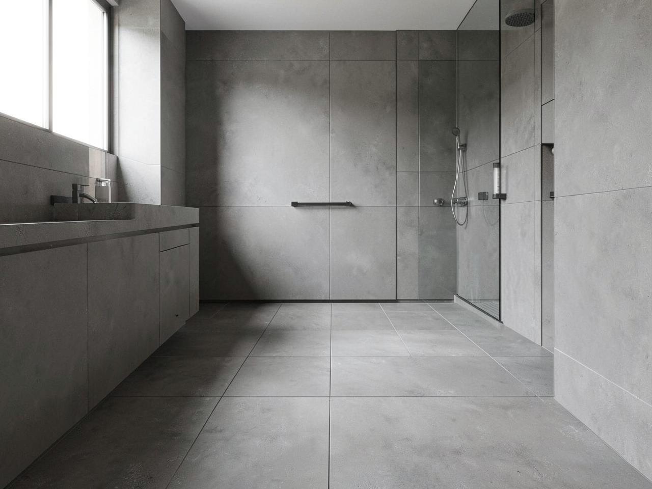 Minimal modern bathroom with large-format stone-look tile flooring and precise grout lines